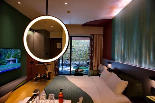 Imagen de la habitación del Hotel Zhi Resort Beijing. Foto 2