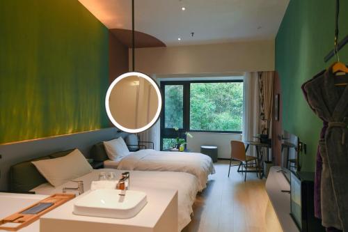 Imagen de la habitación del Hotel Zhi Resort Beijing. Foto 3