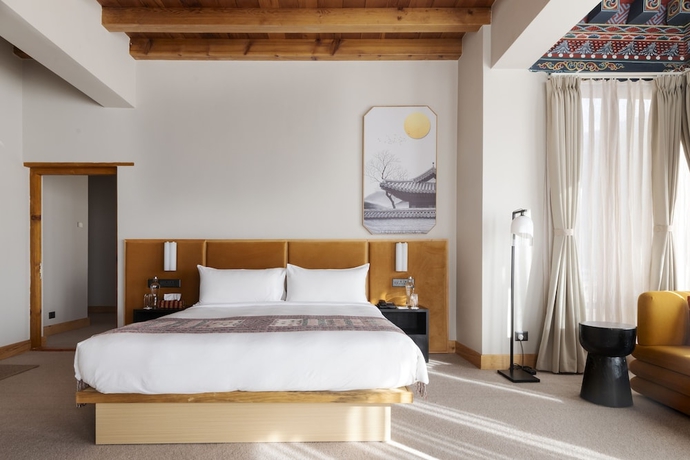 Imagen de la habitación del Hotel Zhiwa Ling Heritage. Foto 2