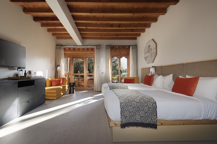 Imagen de la habitación del Hotel Zhiwa Ling Heritage. Foto 7