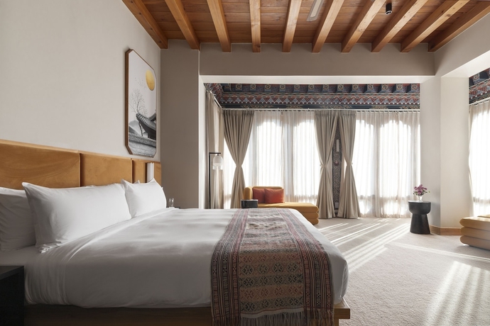 Imagen de la habitación del Hotel Zhiwa Ling Heritage. Foto 9