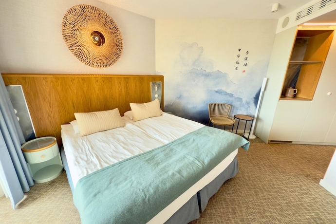 Imagen de la habitación del Hotel Zhong Hua. Foto 9