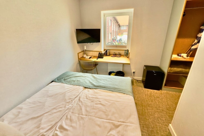 Imagen de la habitación del Hotel Zhong Hua. Foto 10