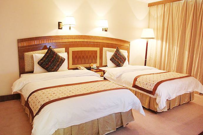 Imagen de la habitación del Hotel Zhongfayuan. Foto 15