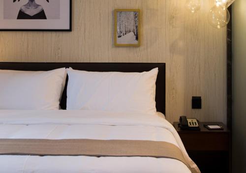 Imagen de la habitación del Hotel Zhonghao Boutique. Foto 4