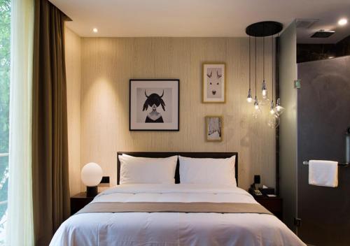 Imagen de la habitación del Hotel Zhonghao Boutique. Foto 8