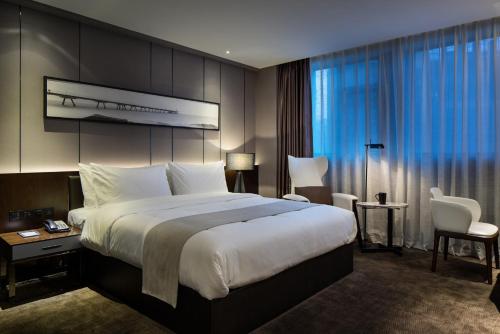 Imagen de la habitación del Hotel Zhonghao International. Foto 8