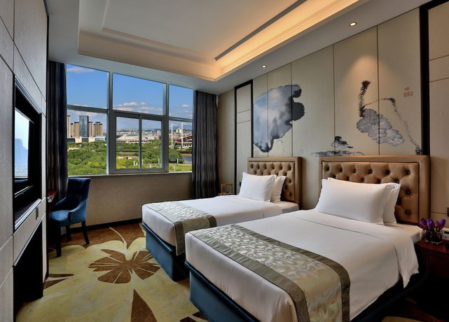 Imagen de la habitación del Hotel Zhonglian Kaixin. Foto 8