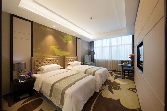 Imagen de la habitación del Hotel Zhonglian Kaixin. Foto 10