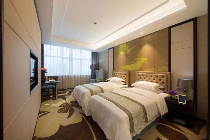 Imagen de la habitación del Hotel Zhonglian Kaixin. Foto 14