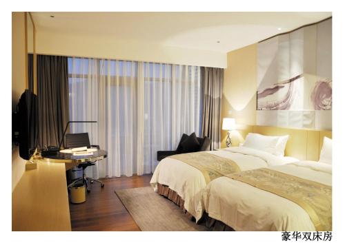 Imagen de la habitación del Hotel Zhongxin Jinling And Resort. Foto 7