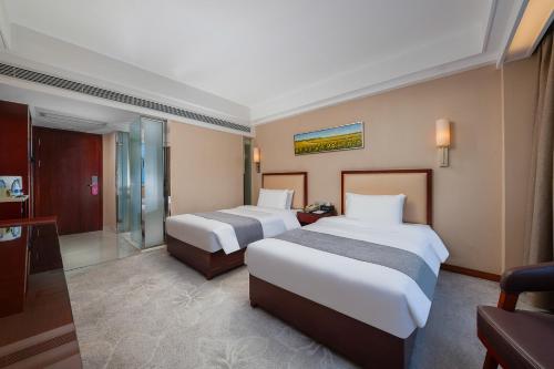 Imagen de la habitación del Hotel Zhongyi - Guangzhou Feixiang Park Metro Station Wanda Plaza. Foto 18