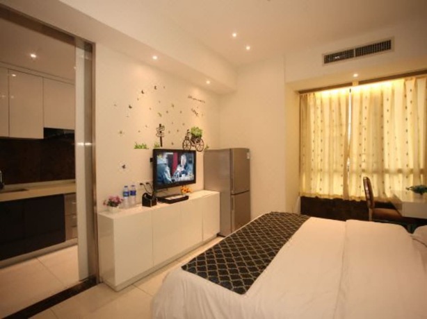 Imagen de la habitación del Hotel Zhu Mei La Apartment. Foto 3
