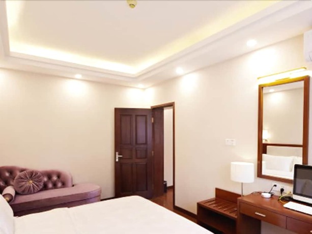 Imagen de la habitación del Hotel Zhu Yuan. Foto 14
