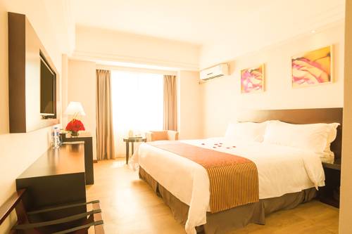 Imagen de la habitación del Hotel Zhuhai Aqueen. Foto 8