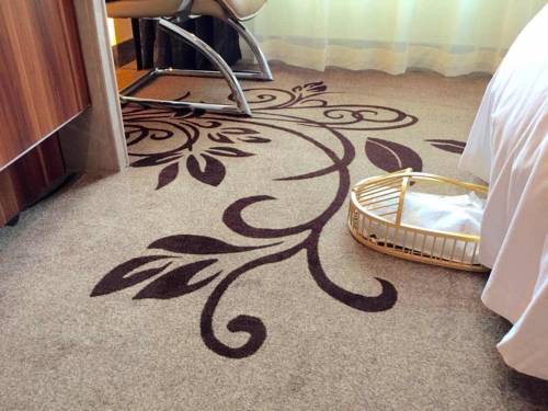 Imagen de la habitación del Hotel Zhuhai Asian Star. Foto 1