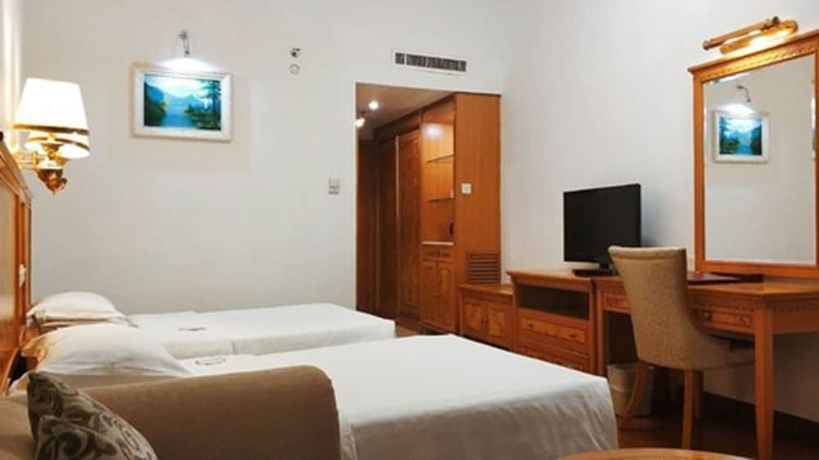 Imagen de la habitación del Hotel Zhuhai Dehan. Foto 6