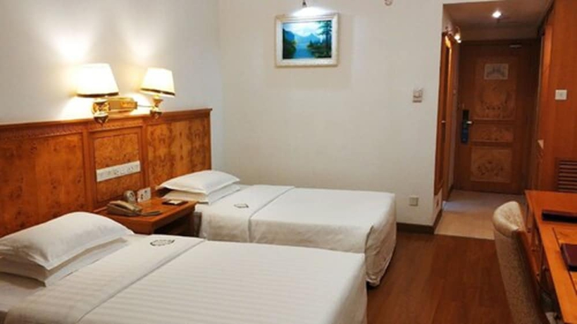 Imagen de la habitación del Hotel Zhuhai Dehan. Foto 7