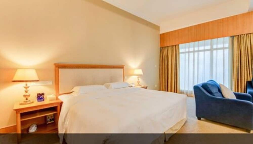 Imagen de la habitación del Hotel Zhuhai Dehan. Foto 11