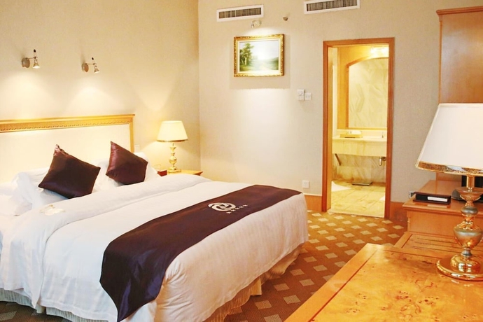 Imagen de la habitación del Hotel Zhuhai Dehan. Foto 13
