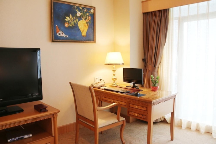 Imagen de la habitación del Hotel Zhuhai Dehan. Foto 18