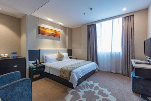 Imagen de la habitación del Hotel Zhuhai Huayu Minfu. Foto 7