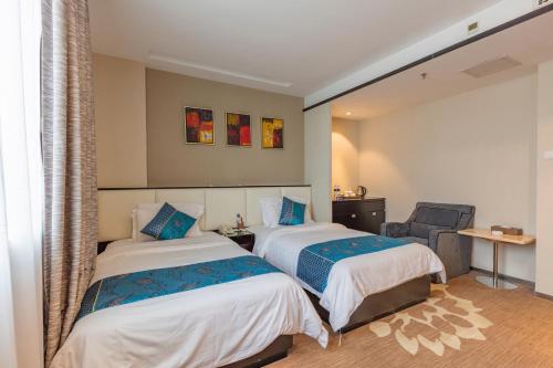 Imagen de la habitación del Hotel Zhuhai Huayu Minfu. Foto 10