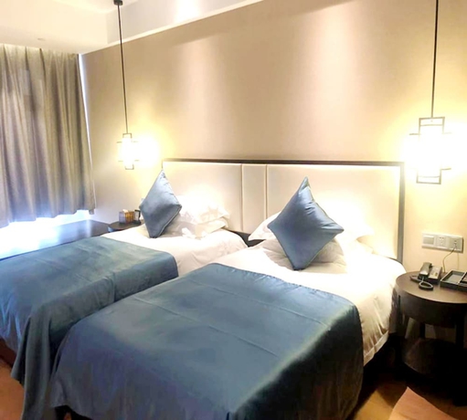 Imagen de la habitación del Hotel Zhuji Grand. Foto 11