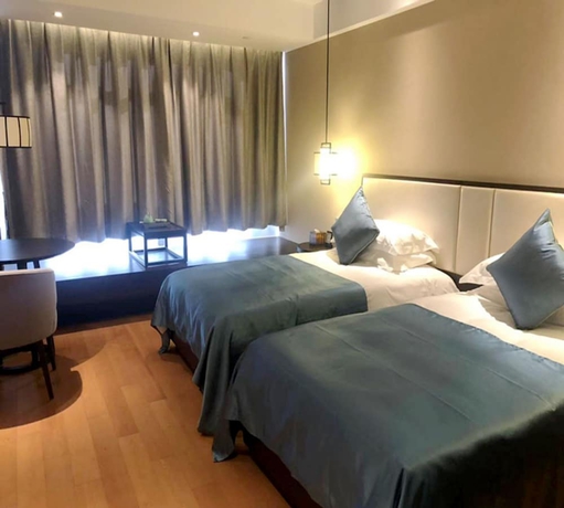 Imagen de la habitación del Hotel Zhuji Grand. Foto 12