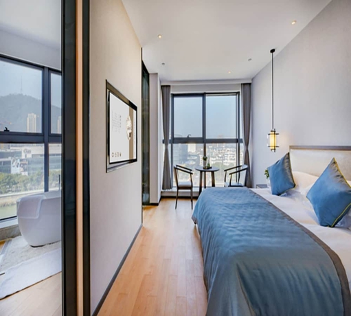 Imagen de la habitación del Hotel Zhuji Grand. Foto 14