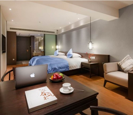 Imagen de la habitación del Hotel Zhuji Grand. Foto 16