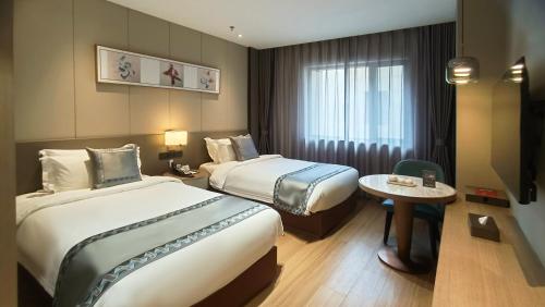Imagen de la habitación del Hotel Zhuo Ruiyunrui. Foto 14