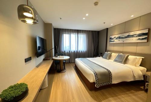 Imagen de la habitación del Hotel Zhuo Ruiyunrui. Foto 15