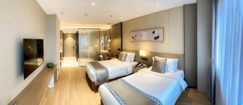 Imagen de la habitación del Hotel Zhuo Ruiyunrui. Foto 17