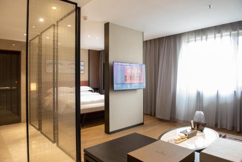 Imagen de la habitación del Hotel Zhuo Ruiyunrui. Foto 18