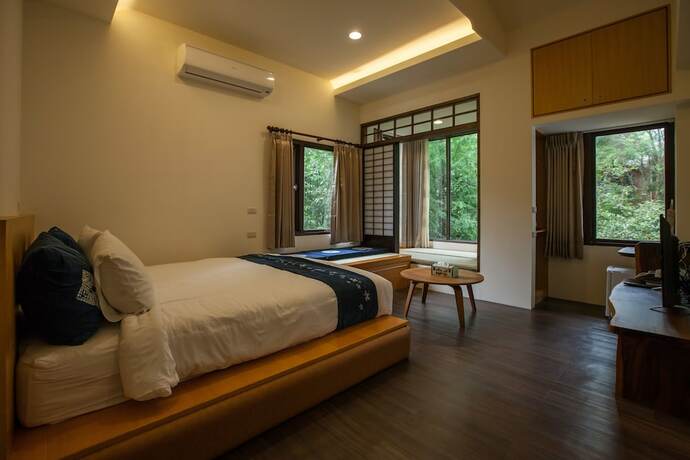 Imagen de la habitación del Hotel Zhuo Ye Cottage. Foto 11