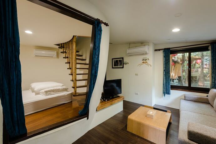 Imagen de la habitación del Hotel Zhuo Ye Cottage. Foto 13