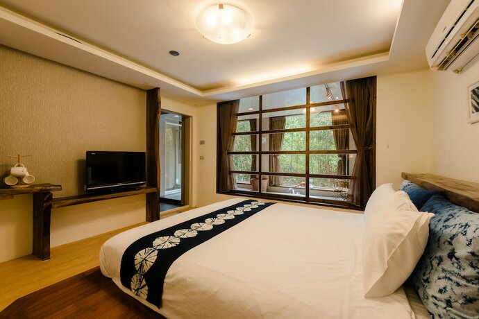 Imagen de la habitación del Hotel Zhuo Ye Cottage. Foto 18