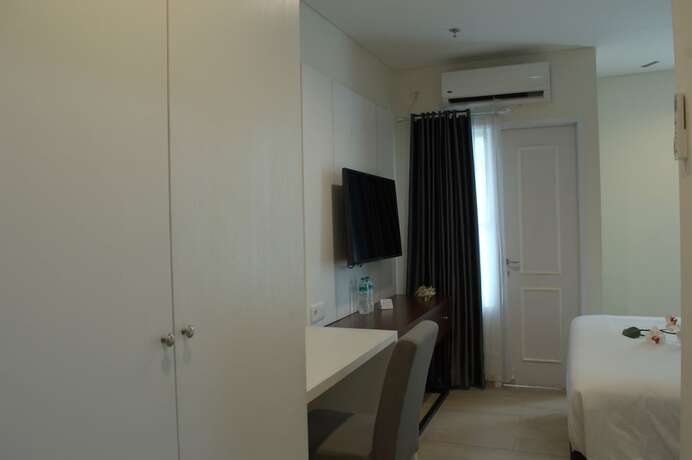 Imagen de la habitación del Hotel Zia Sanno Menteng Residences Jakarta. Foto 7