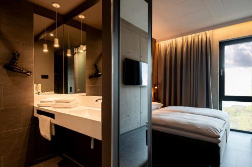Imagen de la habitación del Hotel Zleep Zürich-Kloten. Foto 19