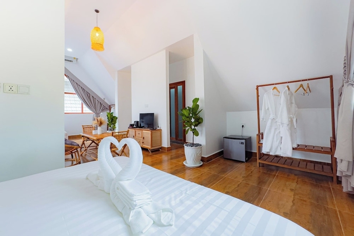Imagen de la habitación del Hotel Zodiac Bungalows. Foto 7