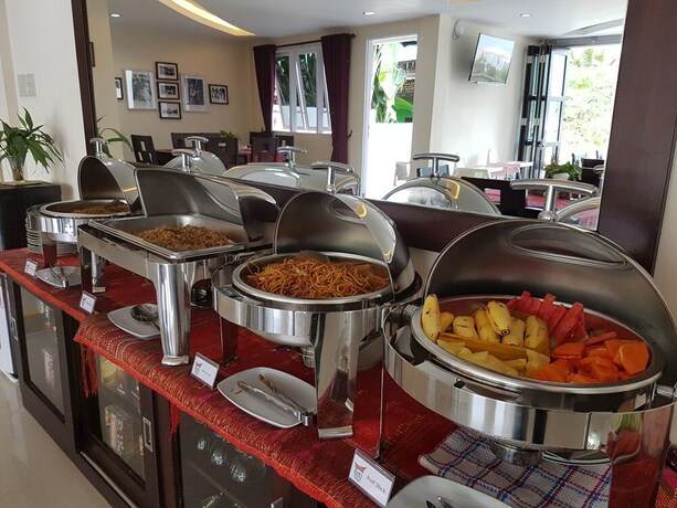 Imagen del bar/restaurante del Hotel Zoe S Paradise Waterfront Hotel. Foto 7