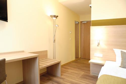 Imagen de la habitación del Hotel & Gasthaus DAS R&Ouml;HRL Straubing. Foto 5