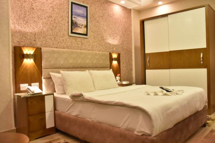 Imagen de la habitación del Hotel and Apartments Jewel Al Nasr. Foto 15