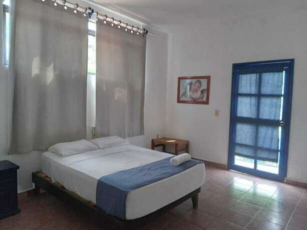 Imagen de la habitación del Hotel and Hostal Mayflower. Foto 10