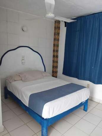 Imagen de la habitación del Hotel and Hostal Mayflower. Foto 13