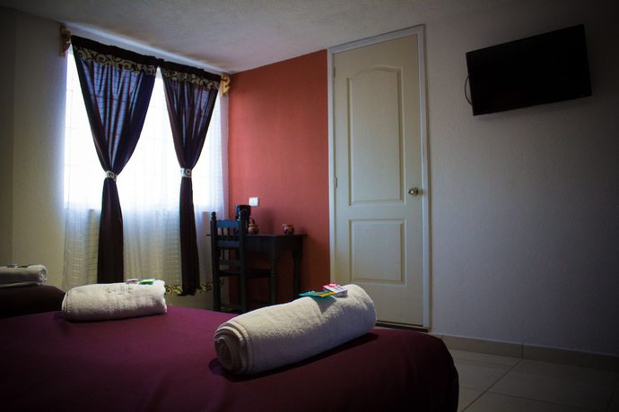 Imagen de la habitación del Hotel and Suites Cerro Rojo. Foto 5