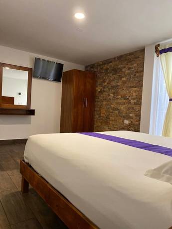 Imagen de la habitación del Hotel and Suites Cerro Rojo. Foto 8