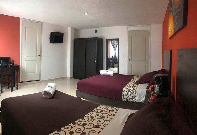 Imagen de la habitación del Hotel and Suites Cerro Rojo. Foto 12