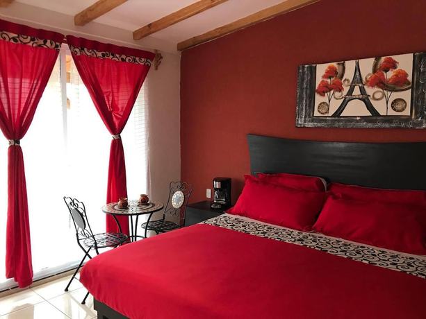 Imagen de la habitación del Hotel and Suites Cerro Rojo. Foto 13